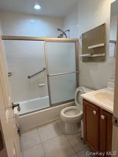 a white toilet sitting next to a bathroom sink