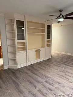 a view of an empty room with a fireplace