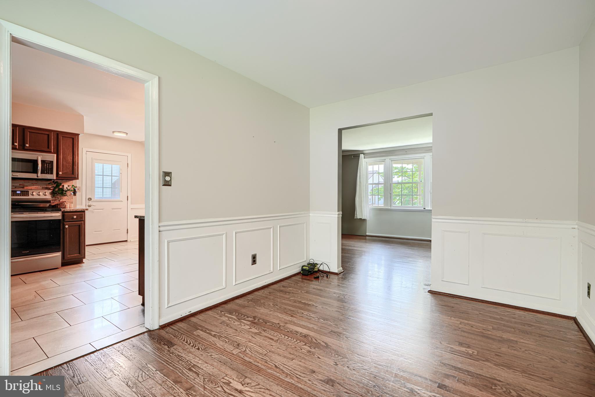 1353 Sweetbriar Lane Bel Air, MD 21014 - Photo 12 of 43 wooden floor in kitchen and empty room with wooden floor