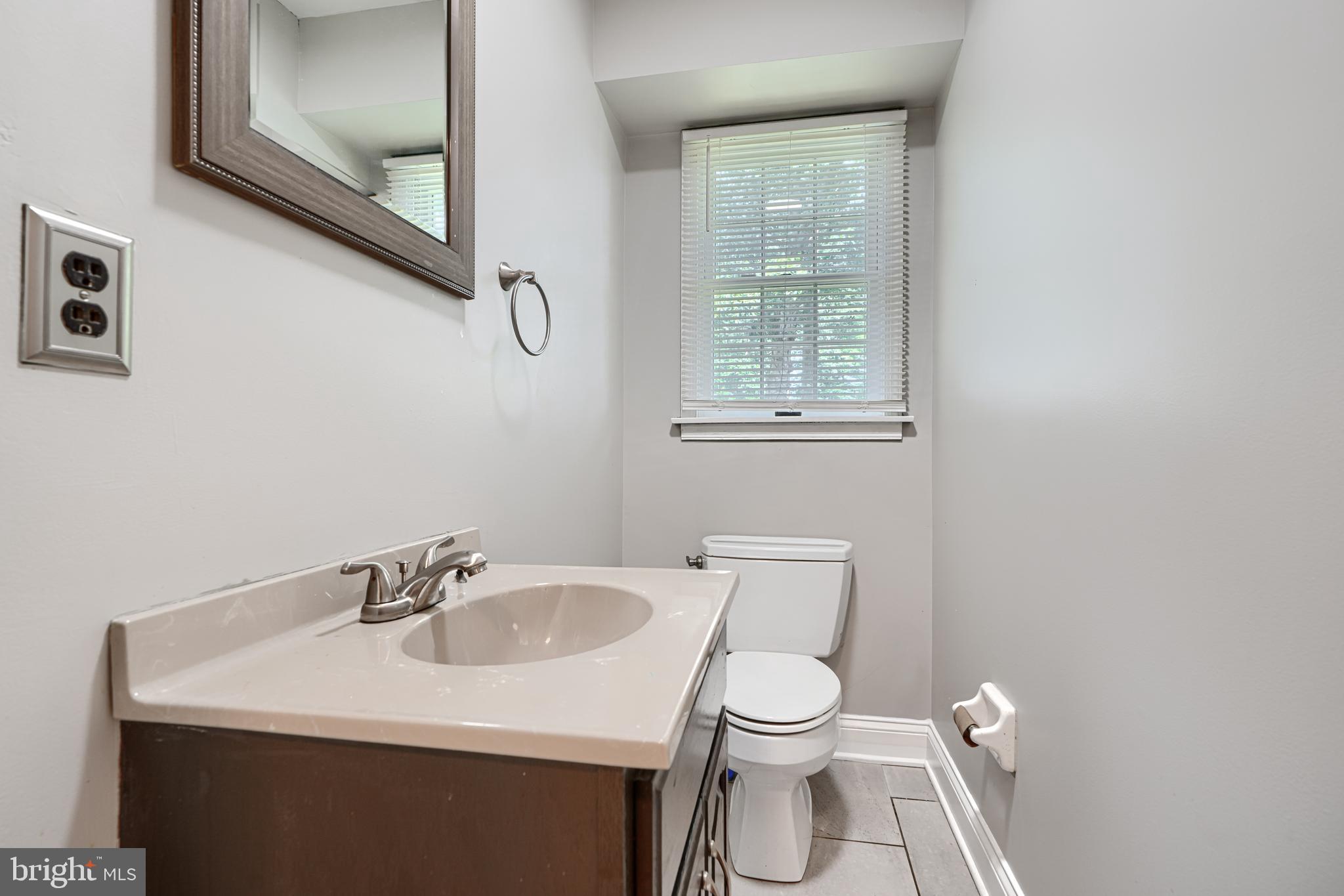 1353 Sweetbriar Lane Bel Air, MD 21014 - Photo 16 of 43 a white toilet sitting next to a bathroom sink
