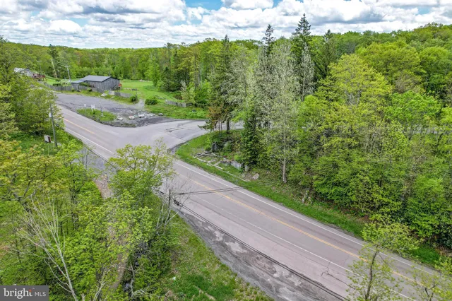 a view of a large body of water with a small yard