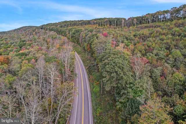 a view of mountain with lake view