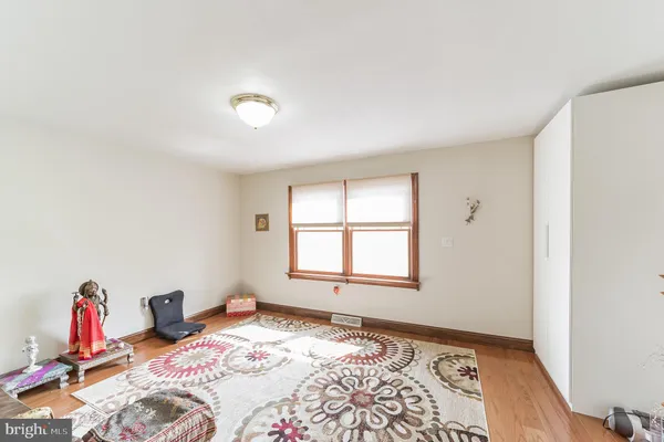 a room with a bed and a large window