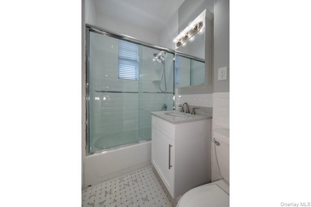 726 Howell Avenue, Unit B Riverhead, NY 11901 - Photo 7 of 7 a bathroom with a sink toilet and shower