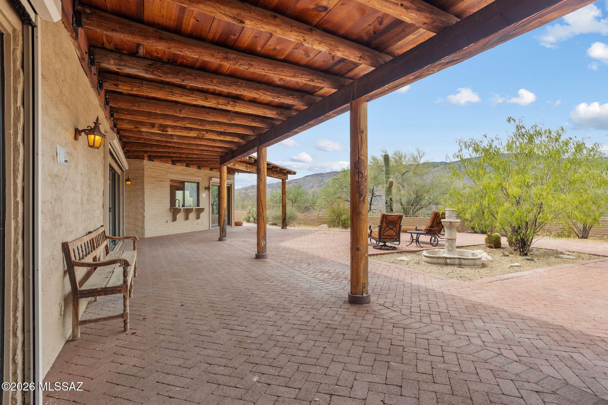 7171 South X9 Ranch Road Vail, AZ 85641 - Photo 44 of 50 Primary Bedroom sliding door to patio. Bench not included.