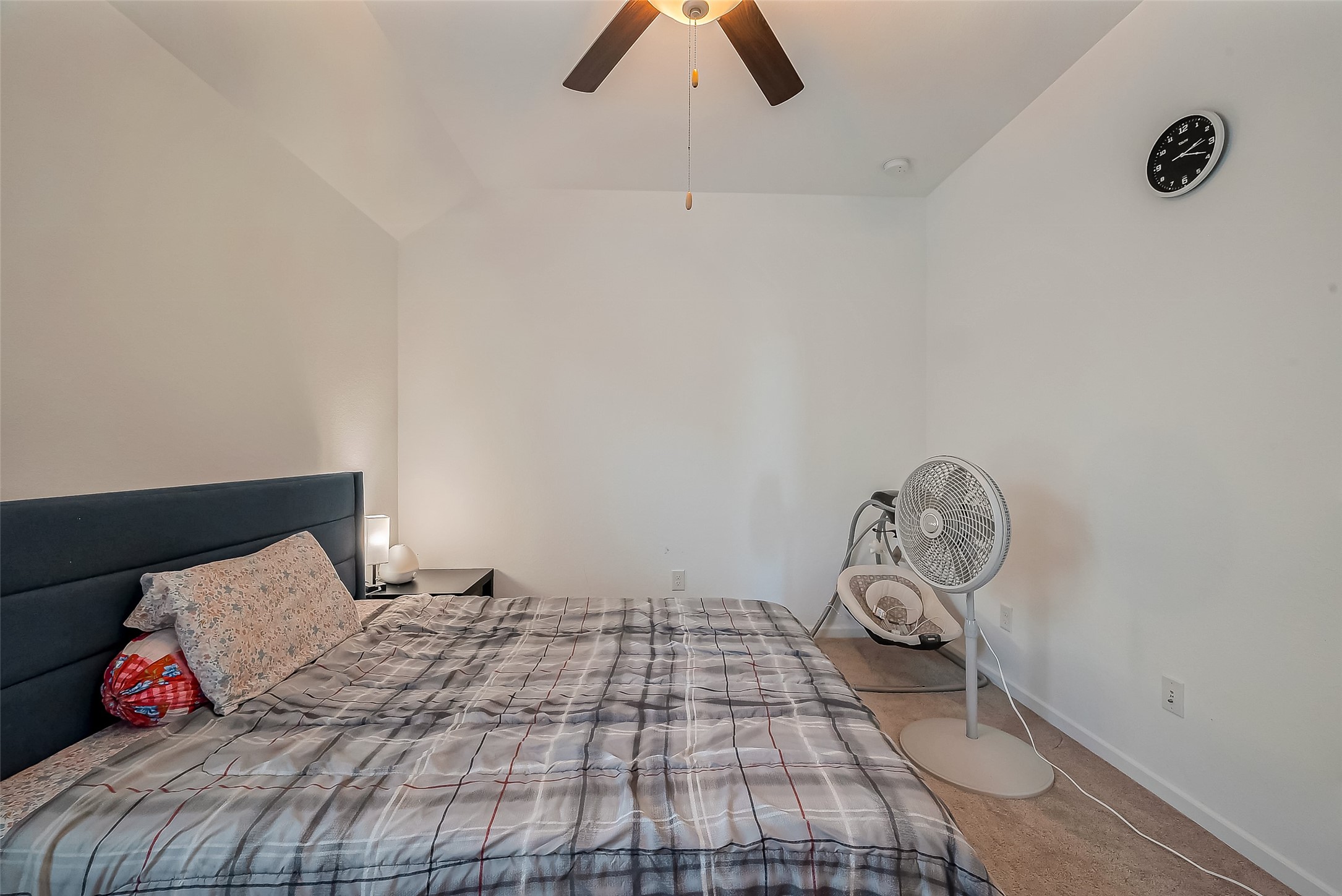 4134 Champlain Way Iowa Colony, TX 77583 - Photo 31 of 38 a bedroom with a bed and a chandelier