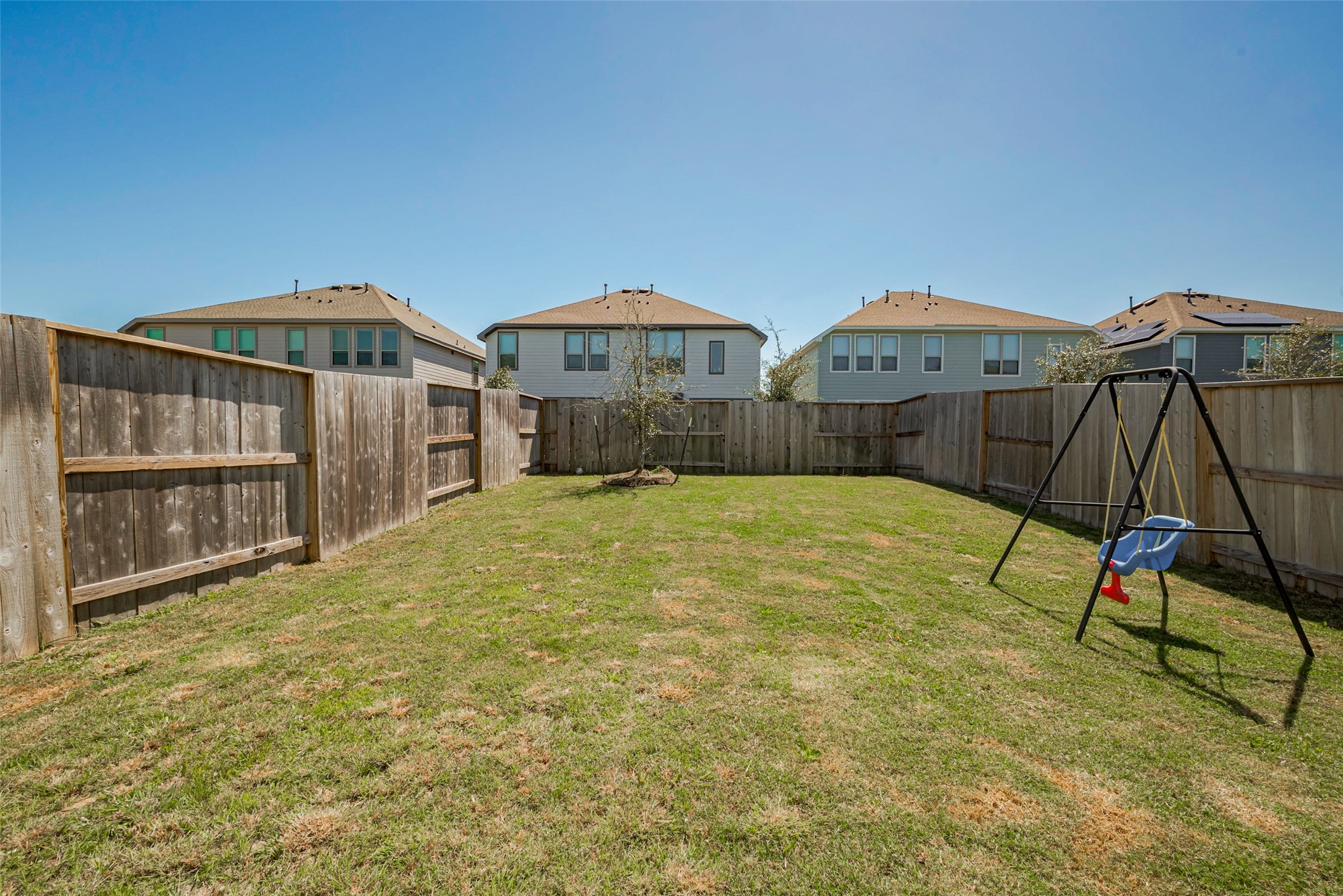 4134 Champlain Way Iowa Colony, TX 77583 - Photo 38 of 38 a view of a house with a yard and table under an umbrella