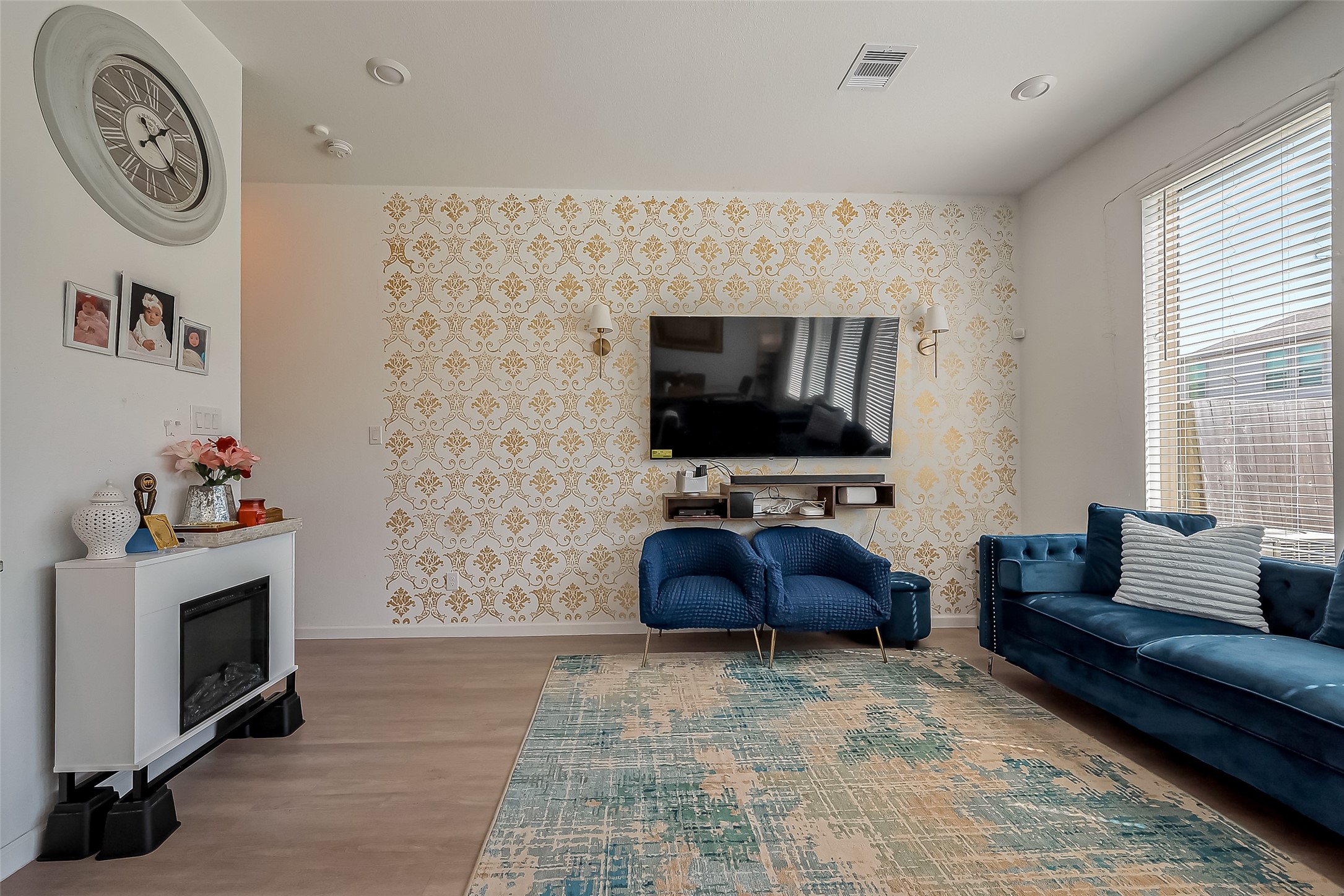 4134 Champlain Way Iowa Colony, TX 77583 - Photo 8 of 38 a living room with furniture and a flat screen tv