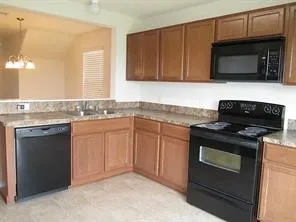 a kitchen with a refrigerator and a window