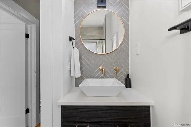 a bathroom with a sink and a mirror