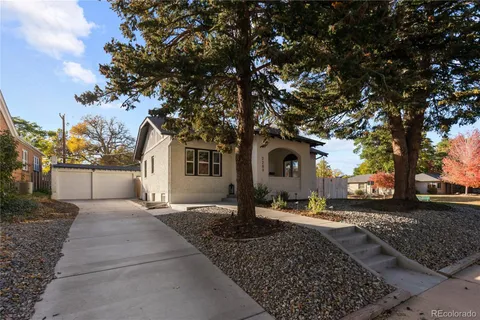a large tree in front of a house