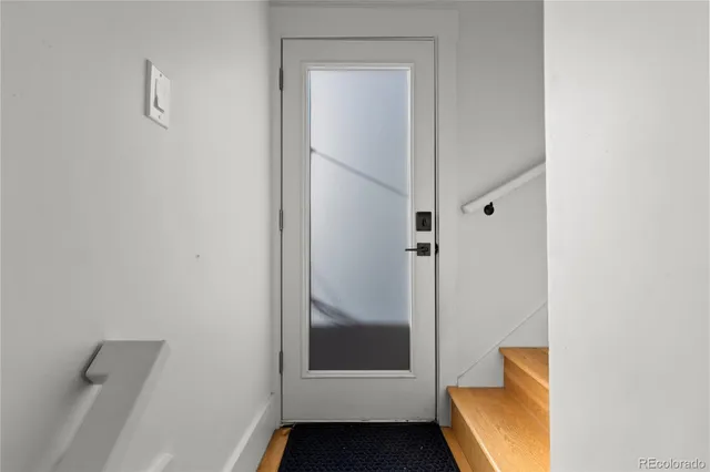 a bathroom with a glass shower door