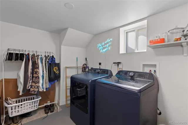 a utility room with closet dryer and washer