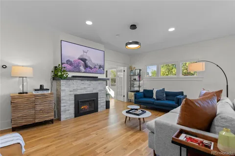a living room with furniture and a fireplace