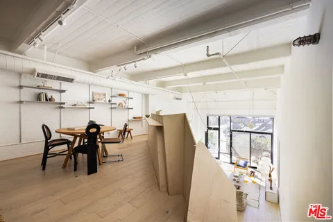 a bedroom with a bed and a table