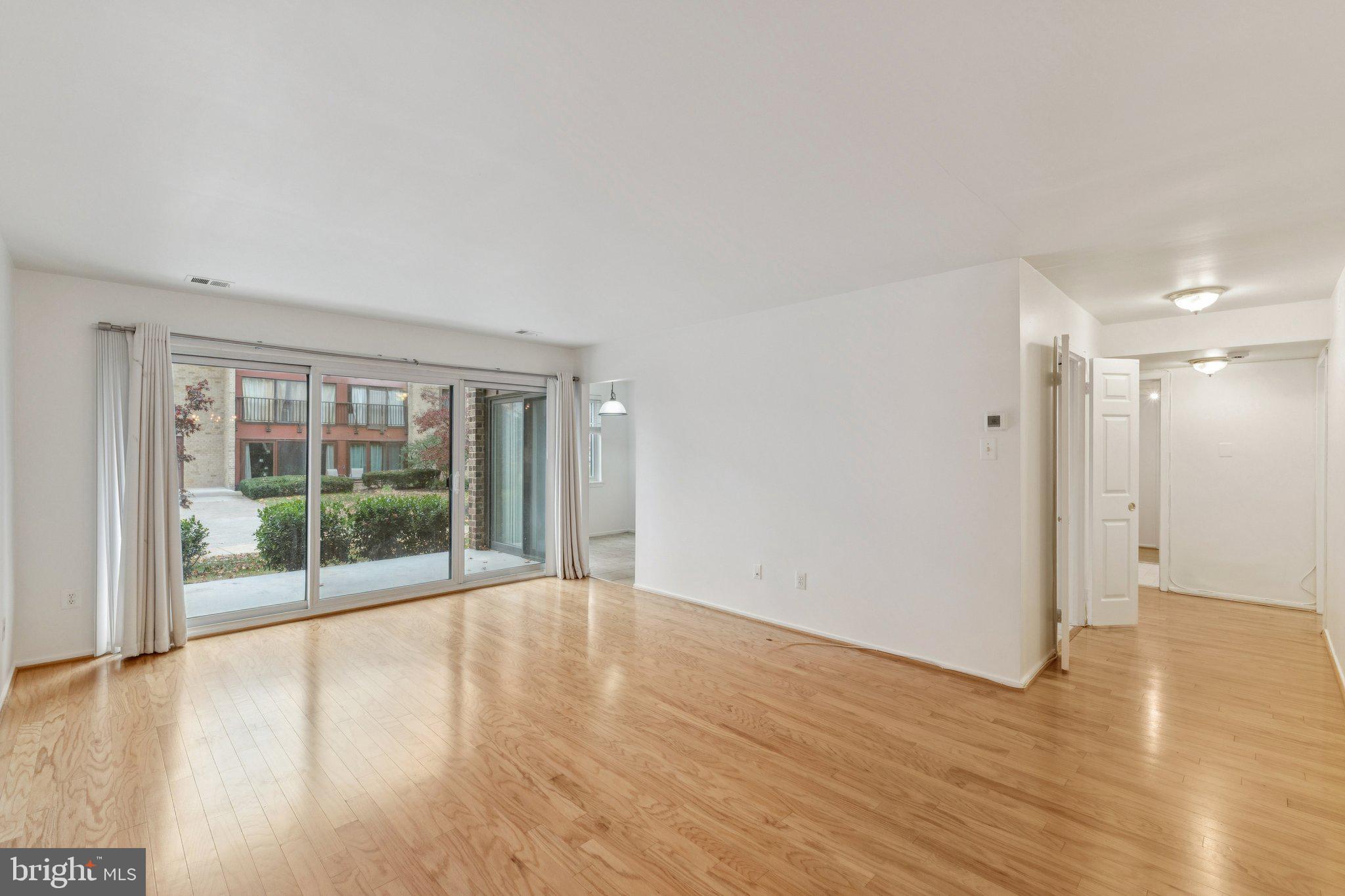2817 Jermantown Road, Unit 108 Oakton, VA 22124 - Photo 7 of 20 a view of wooden floor and brick walls
