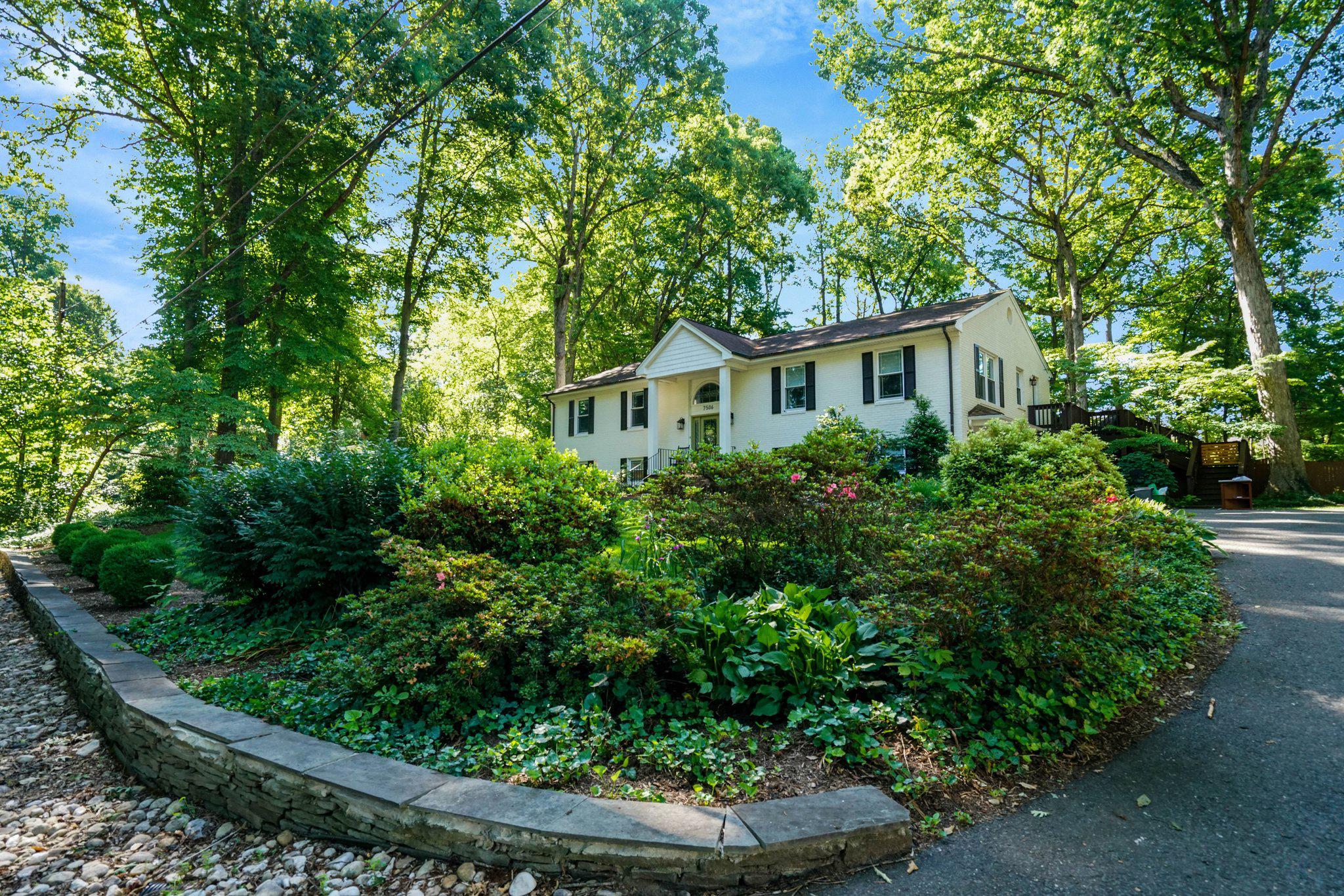 7506 Oriole Avenue Springfield, VA 22150 - Photo 3 of 67 a house with lots of trees in the background
