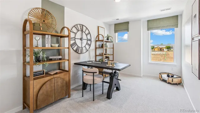 a view of a livingroom with furniture