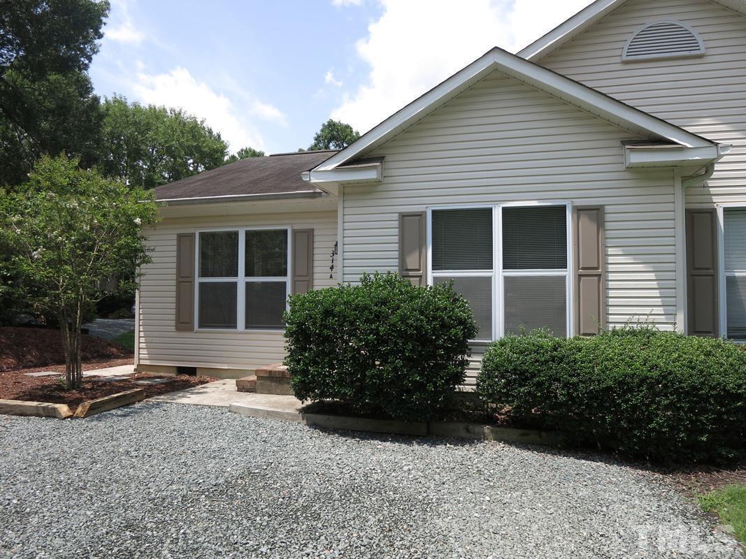 314 Davie Road, Unit A Carrboro, NC 27510 - Photo 1 of 17 a view of a house with backyard and garden