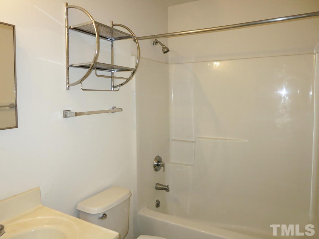 314 Davie Road, Unit A Carrboro, NC 27510 - Photo 12 of 17 a bathroom with a shower and a toilet