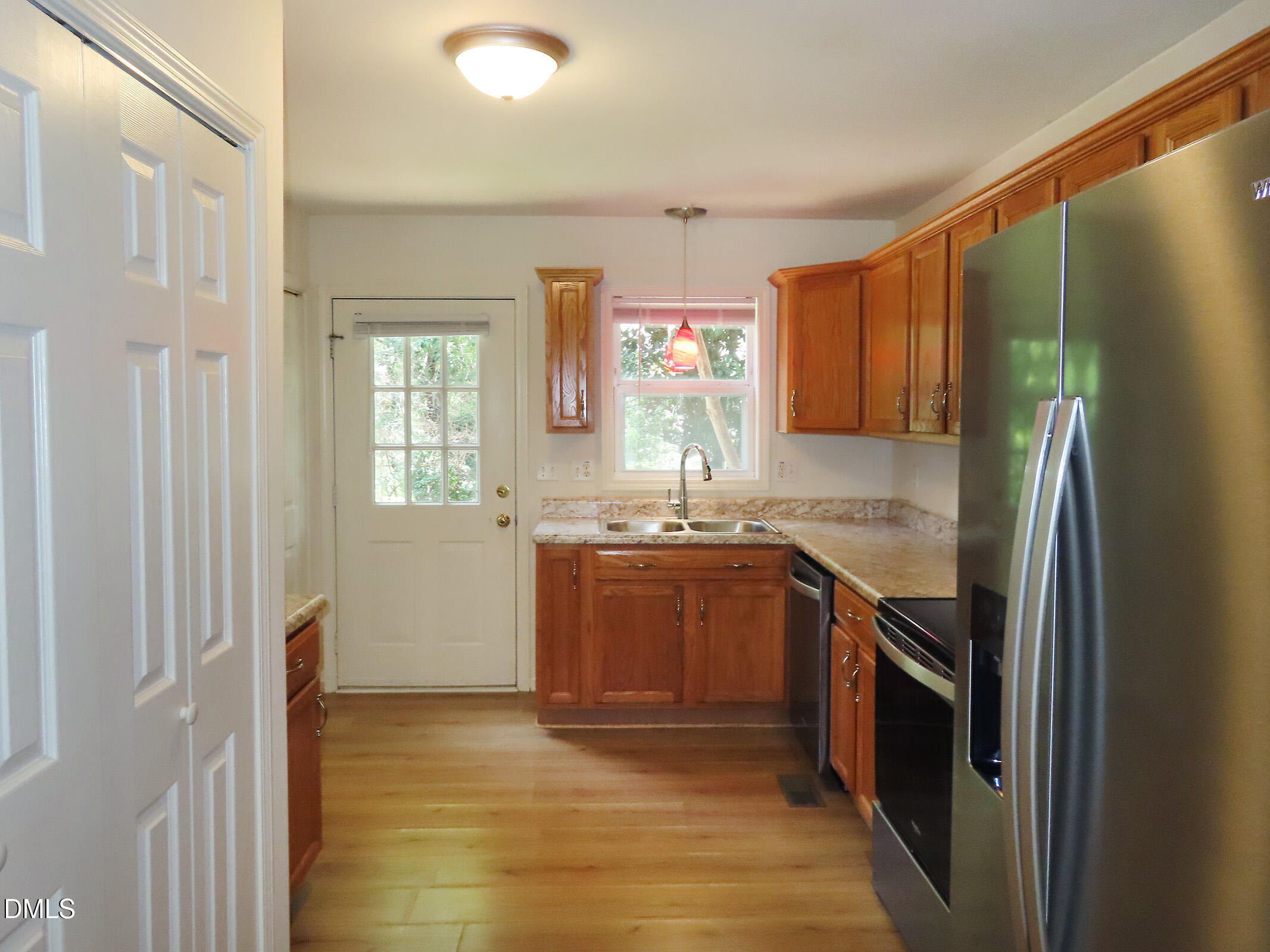 314 Davie Road, Unit A Carrboro, NC 27510 - Photo 7 of 17 a kitchen with stainless steel appliances granite countertop a refrigerator and a sink