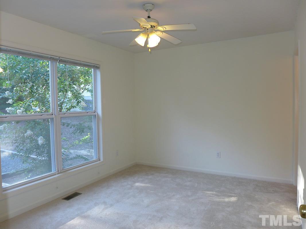 314 Davie Road, Unit A Carrboro, NC 27510 - Photo 9 of 17 a view of room with window and ceiling fan