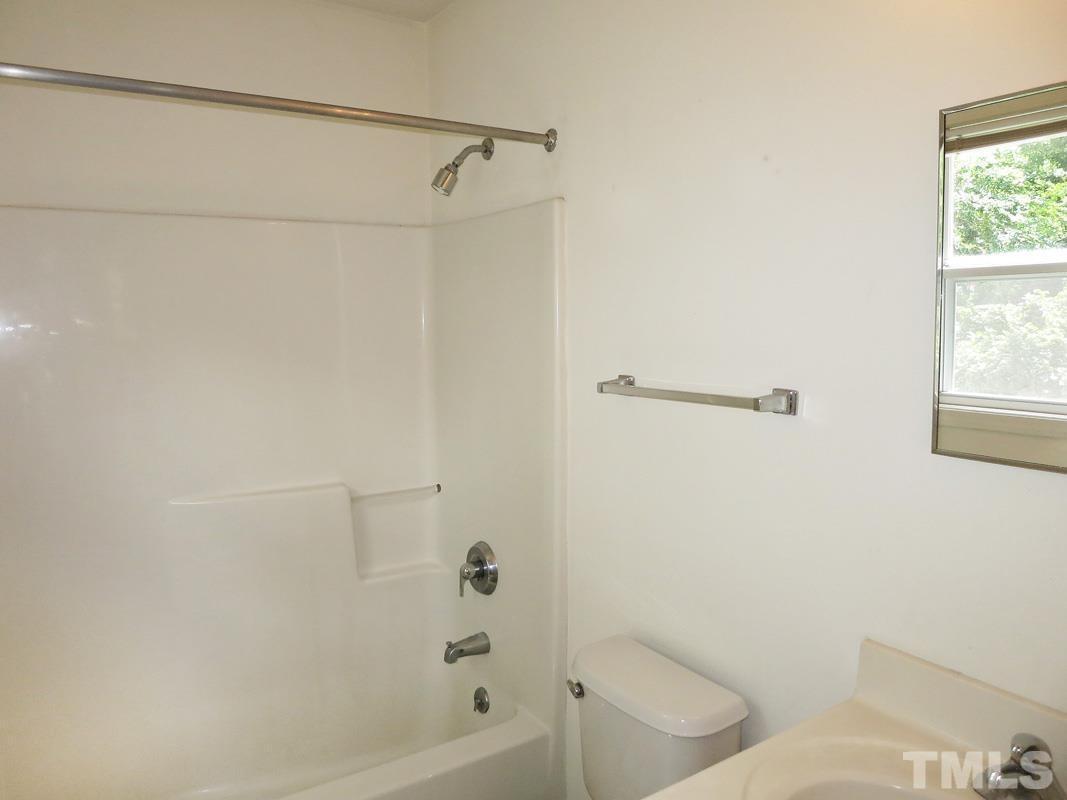 314 Davie Road, Unit A Carrboro, NC 27510 - Photo 10 of 17 a bathroom with a bathtub and a shower