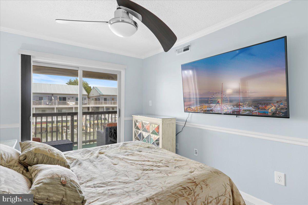 128 Captains Quarters Road, Unit 204 Ocean City, MD 21842 - Photo 16 of 32 Primary Bedroom with access to balcony