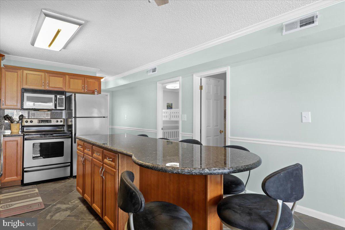 128 Captains Quarters Road, Unit 204 Ocean City, MD 21842 - Photo 7 of 32 Large Island great for entertaining