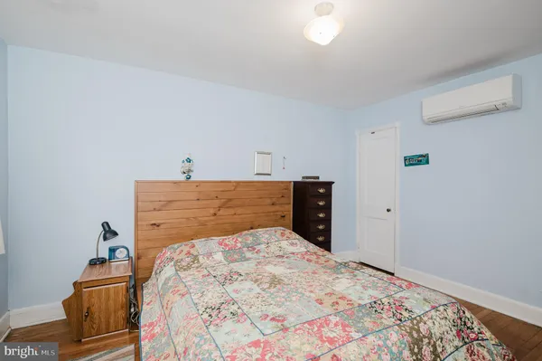 a bedroom with a bed and a table in it