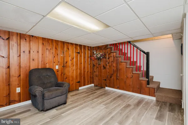 a view of staircase with a small deck