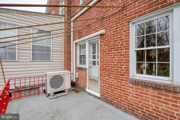 a view of a porch with wooden fence
