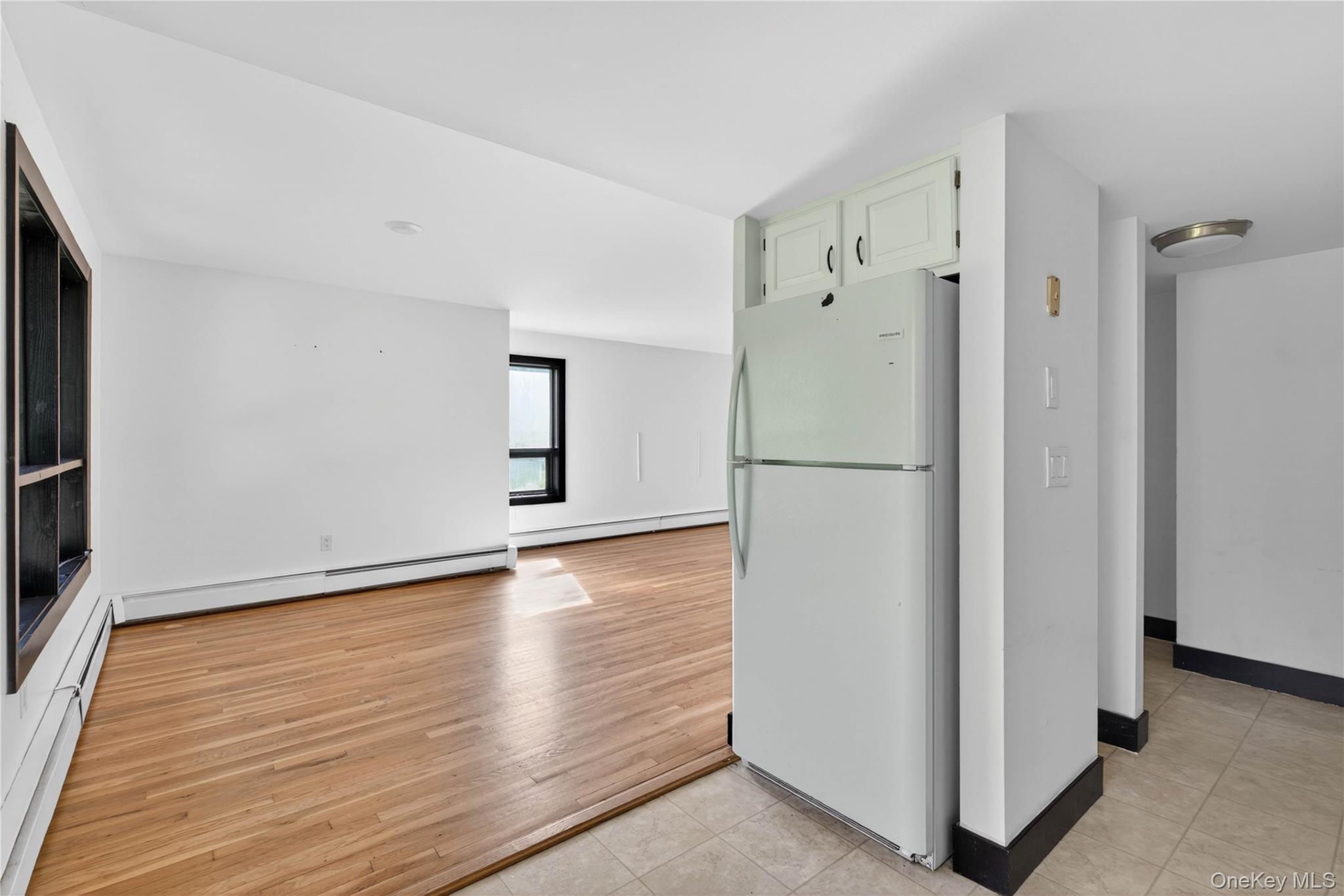 40 Felter Hill Road Monroe, NY 10950 - Photo 13 of 37 a view of a kitchen with wooden floor and a refrigerator