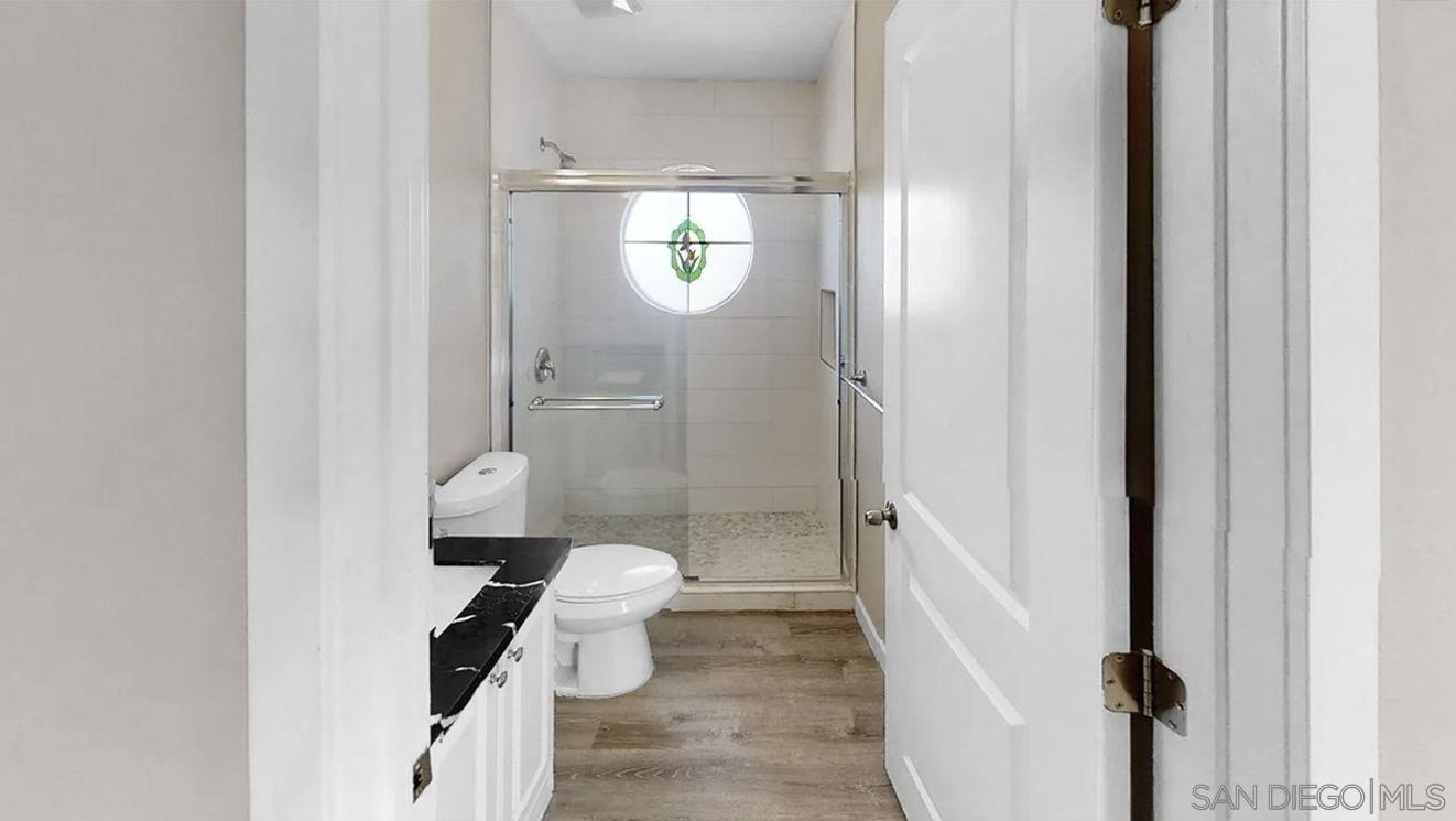 6497 Montezuma Road San Diego, CA 92115 - Photo 11 of 23 a bathroom with a sink and toilet