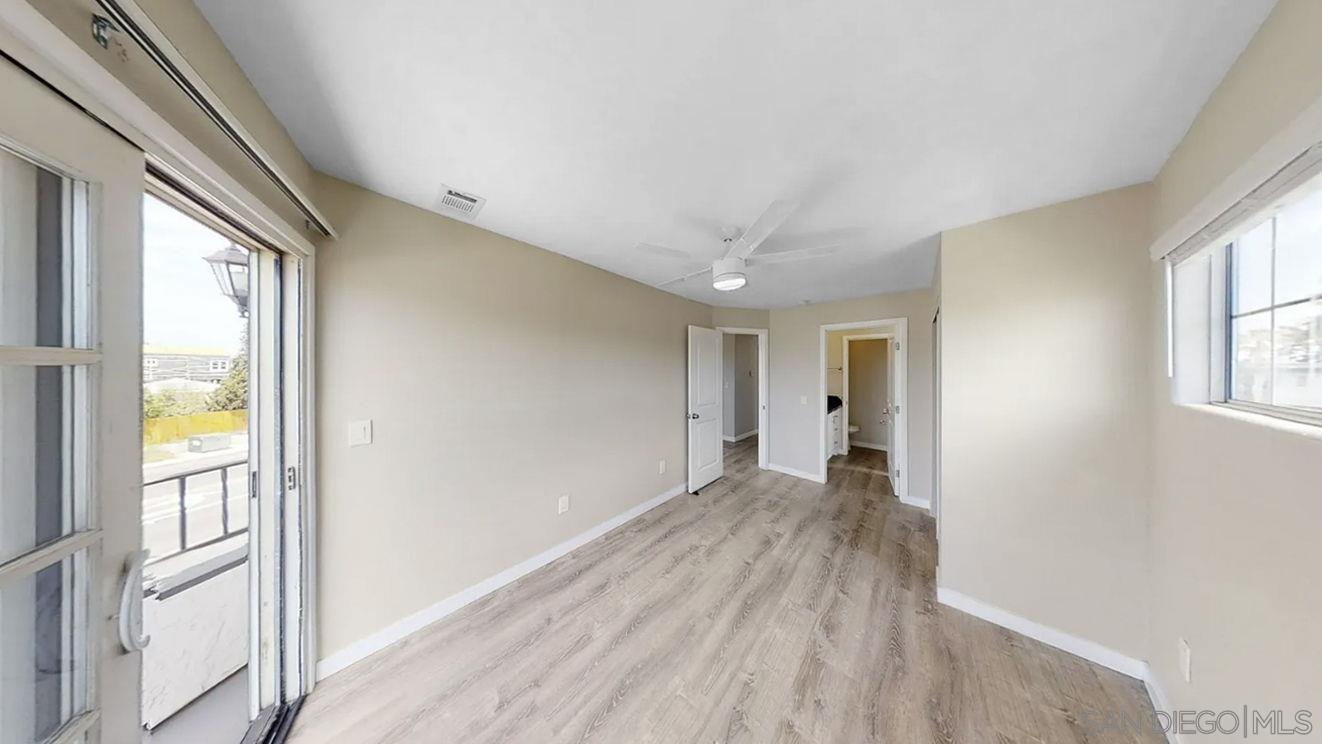 6497 Montezuma Road San Diego, CA 92115 - Photo 15 of 23 a view of empty room with wooden floor and fan