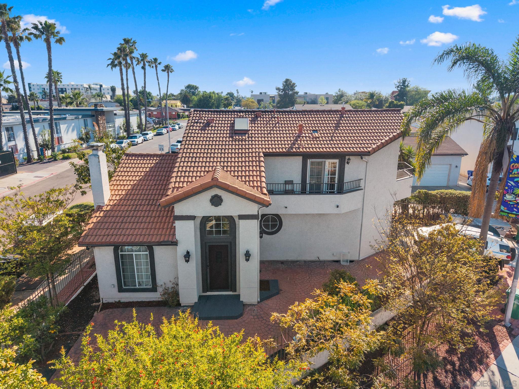 6497 Montezuma Road San Diego, CA 92115 - Photo 2 of 23 a front view of a house with a yard