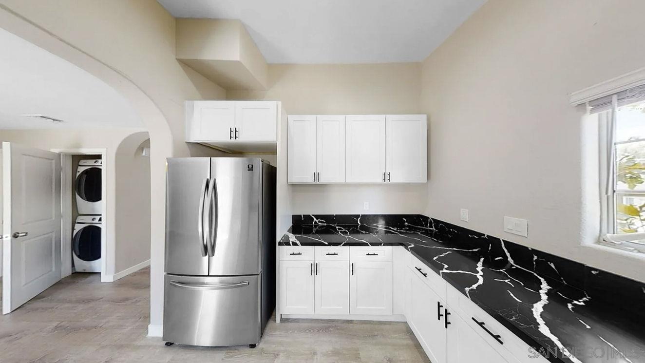 6497 Montezuma Road San Diego, CA 92115 - Photo 6 of 23 a kitchen with a refrigerator and a sink