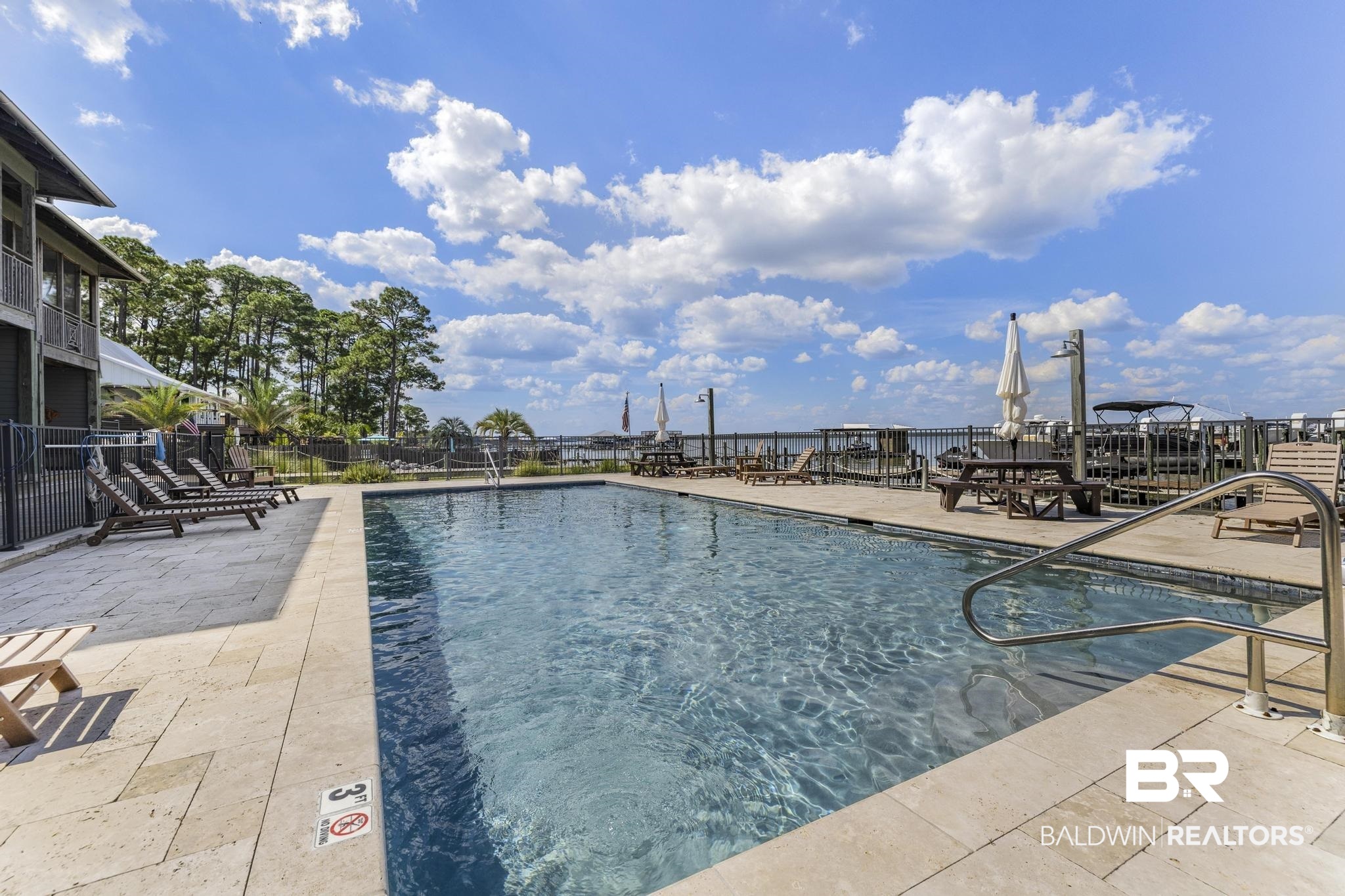 25773 Canal Road Orange Beach, AL 36561 - Photo 21 of 32 Community pool with a patio area