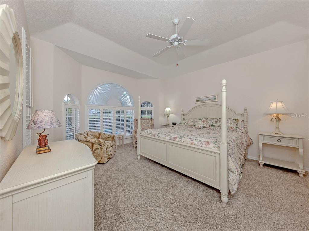 338 St George Court, Unit 11 Venice, FL 34293 - Photo 20 of 79 a living room with furniture and chandelier