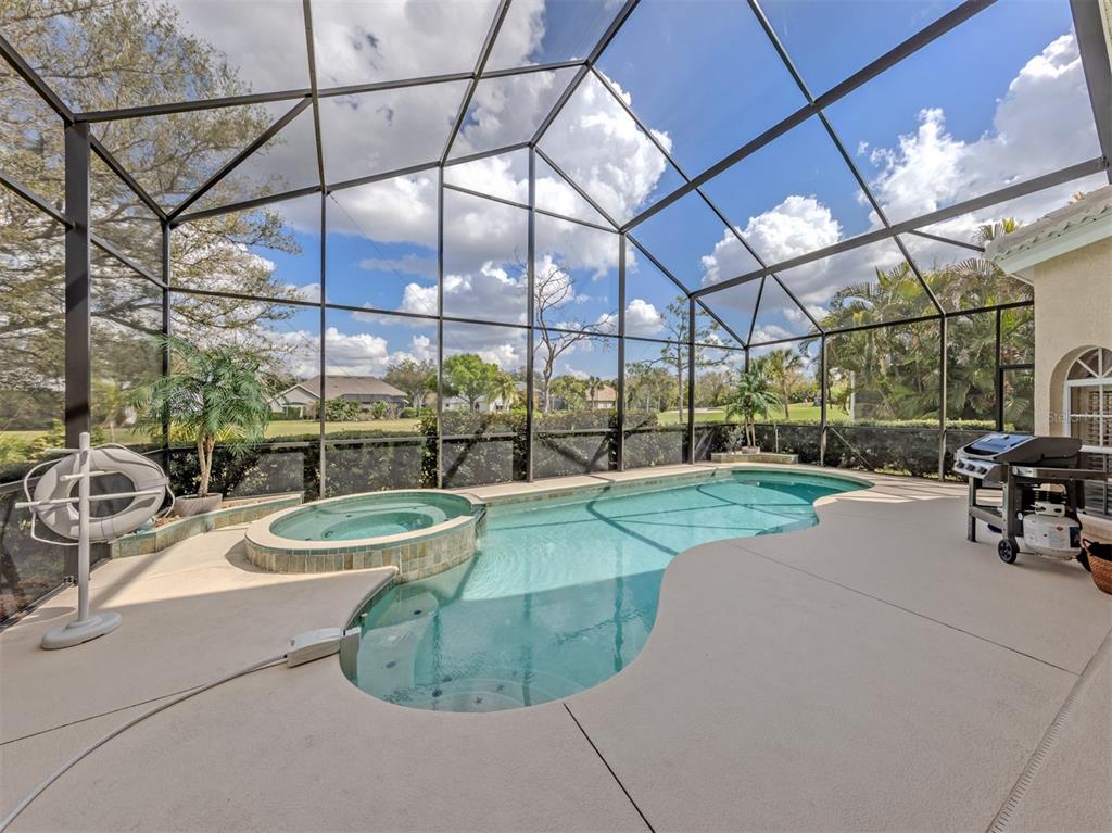 338 St George Court, Unit 11 Venice, FL 34293 - Photo 28 of 79 a view of a swimming pool with a patio