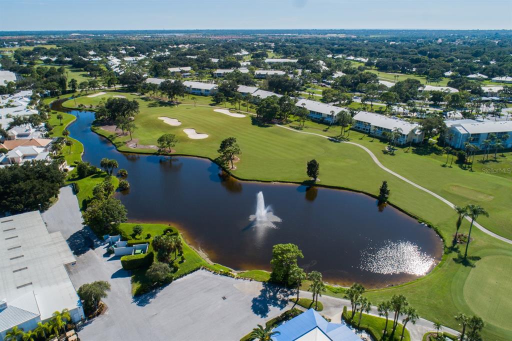 338 St George Court, Unit 11 Venice, FL 34293 - Photo 52 of 79 an aerial view of residential houses with outdoor space and river view