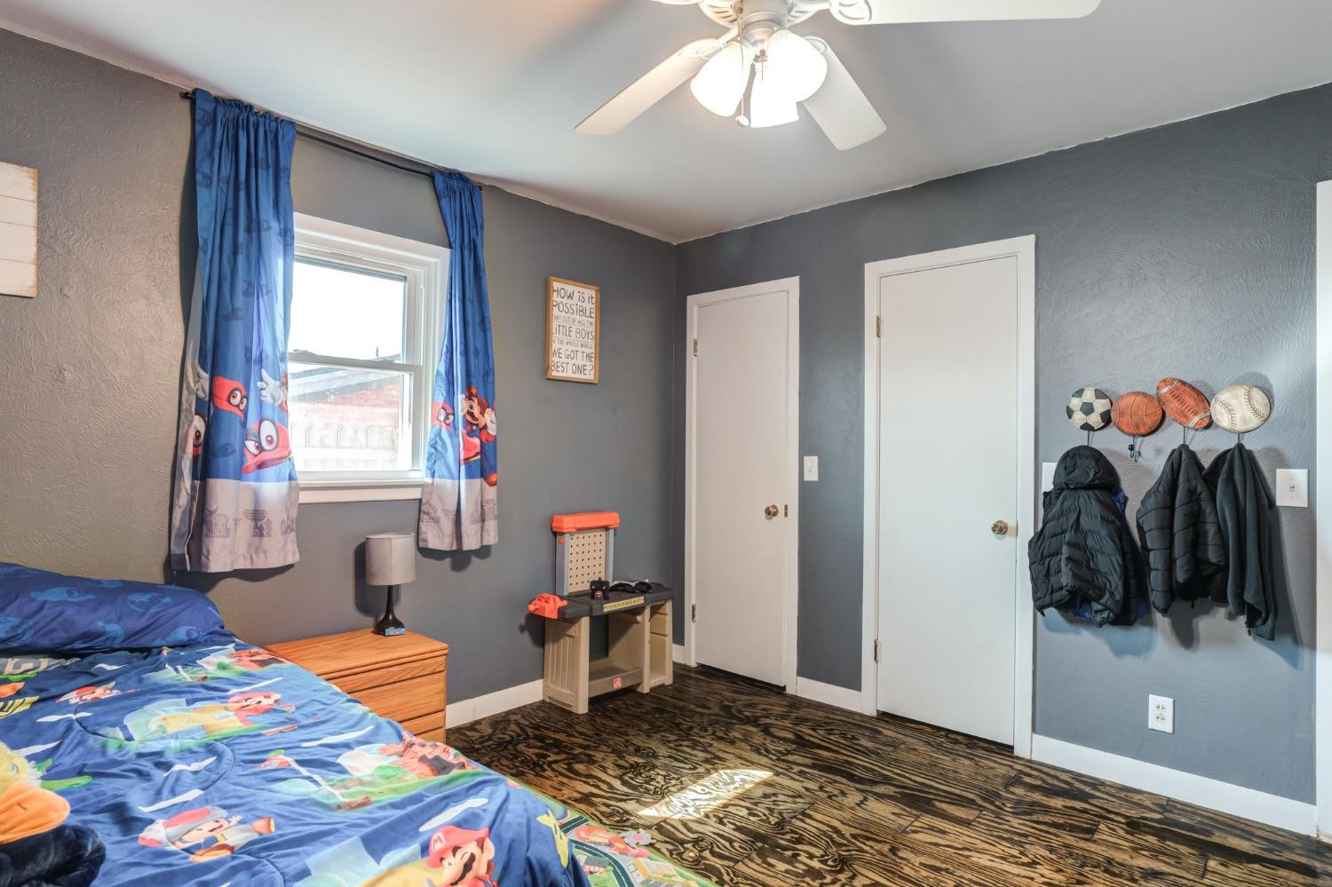 334 West Ave J Muleshoe, TX 79347 - Photo 13 of 18 a bedroom with a bed and a window