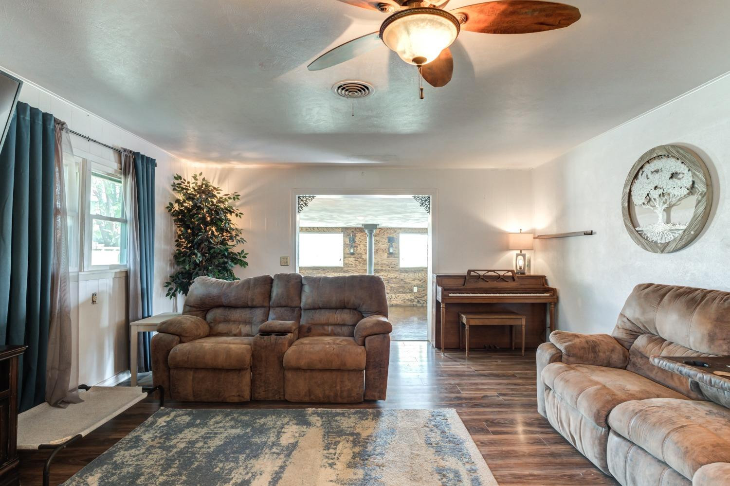 334 West Ave J Muleshoe, TX 79347 - Photo 3 of 18 a living room with furniture and a large window