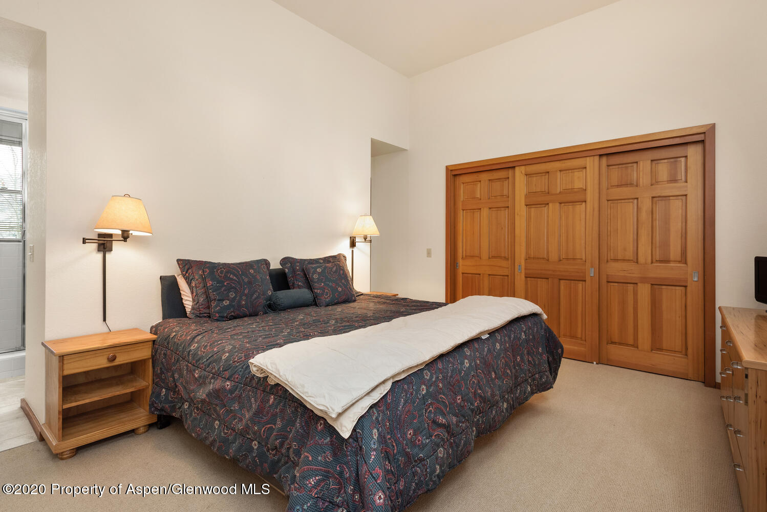 425 Wood Road, Unit 6 Snowmass Village, CO 81615 - Photo 11 of 16 a bedroom with a bed and a closet