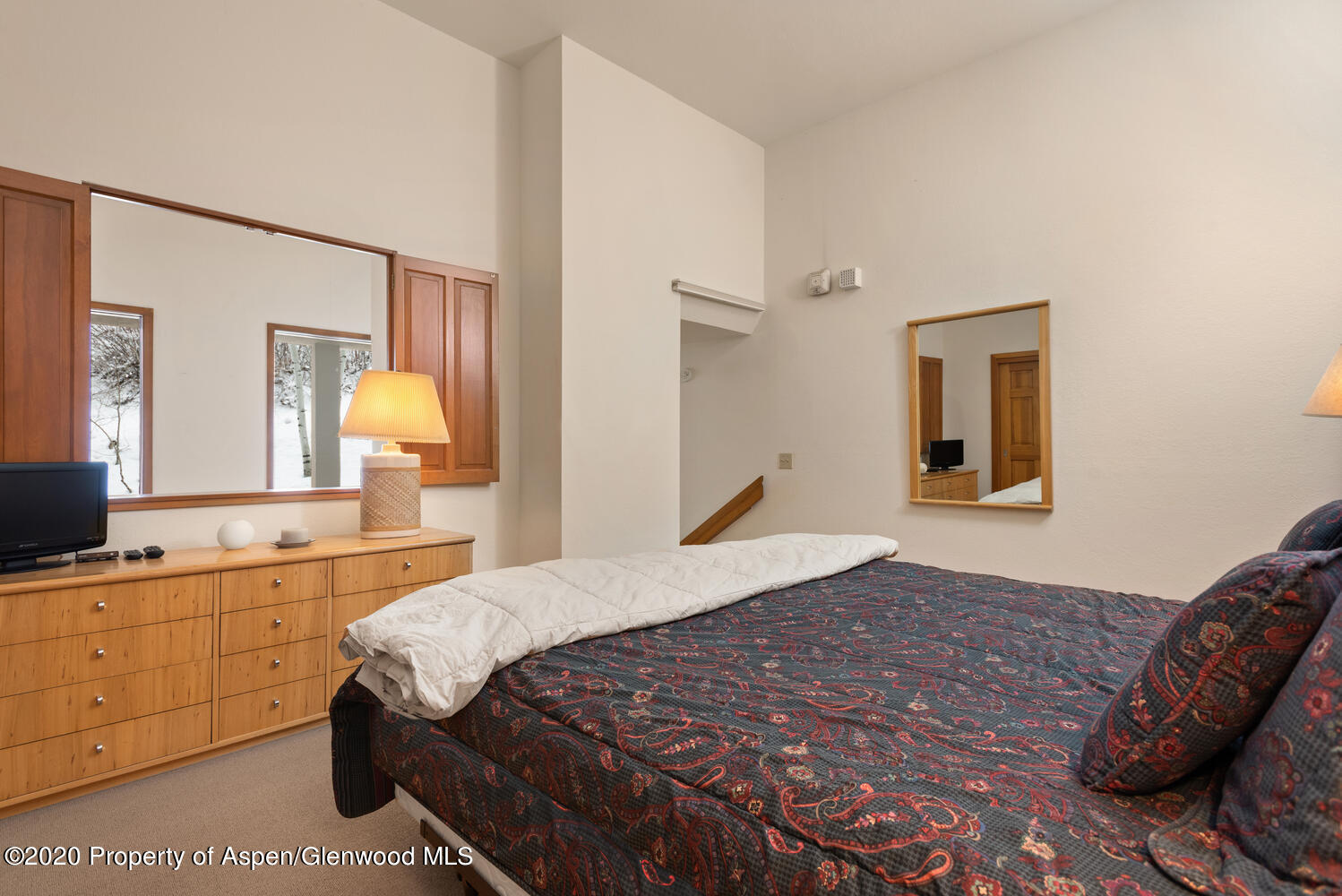 425 Wood Road, Unit 6 Snowmass Village, CO 81615 - Photo 14 of 16 a bedroom with a bed and a dresser