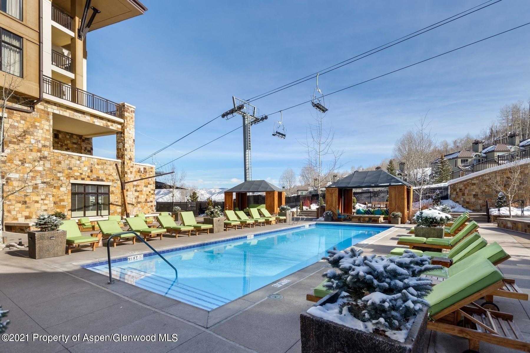 425 Wood Road, Unit 6 Snowmass Village, CO 81615 - Photo 16 of 16 a view of a swimming pool with a patio
