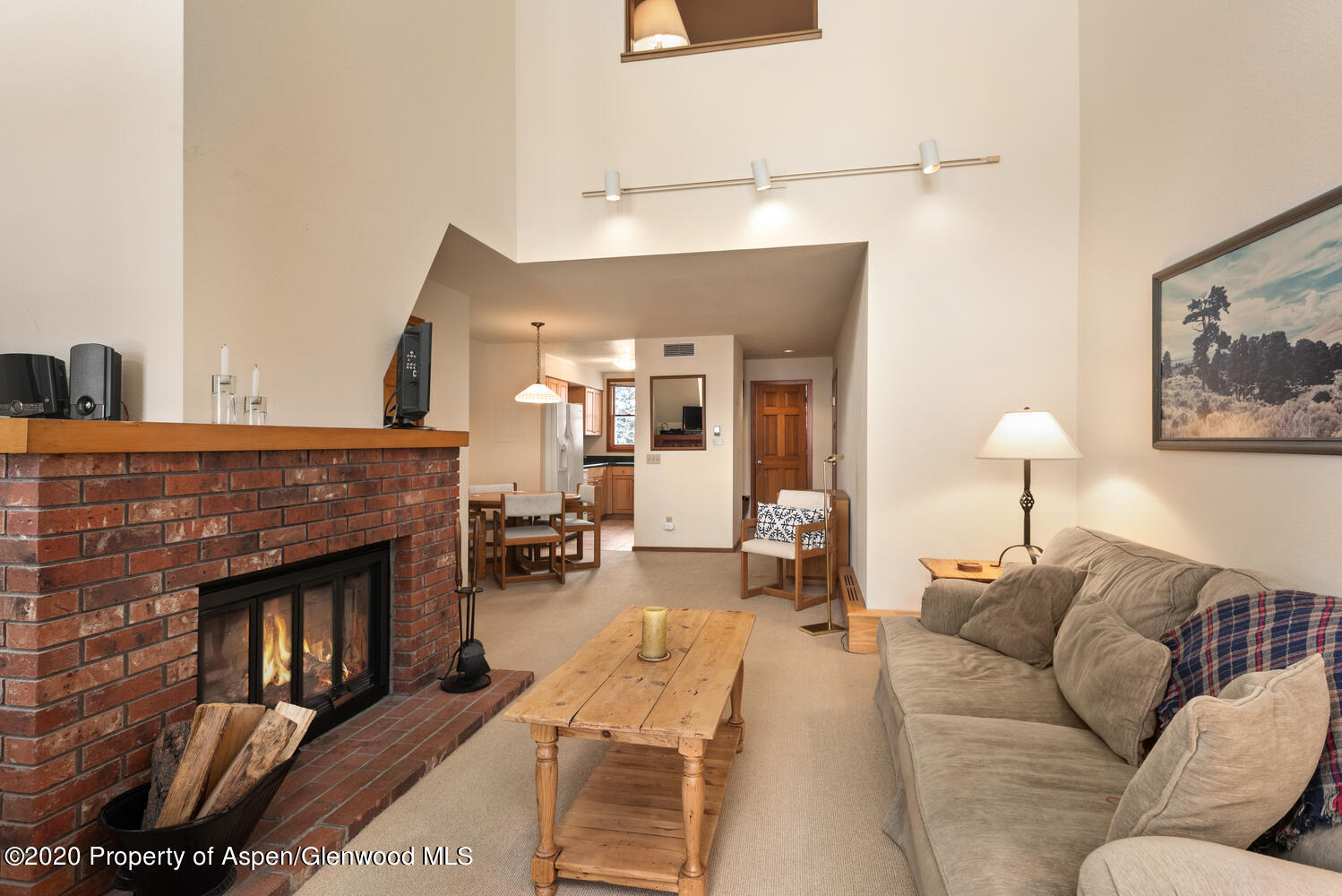 425 Wood Road, Unit 6 Snowmass Village, CO 81615 - Photo 2 of 16 a living room with furniture and a fireplace