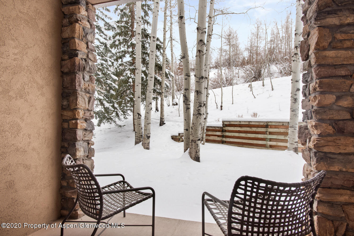 425 Wood Road, Unit 6 Snowmass Village, CO 81615 - Photo 4 of 16 a view of entryway with wooden floor