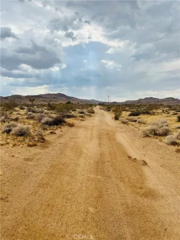 a view of a street with cars