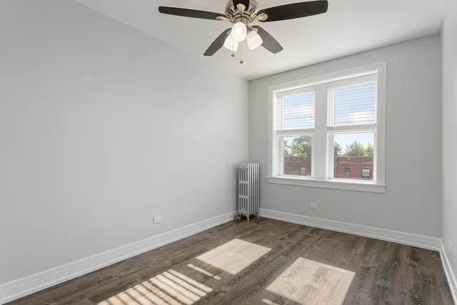 a bathroom with a shower a toilet and sink